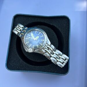 Fossil. Mens watch. All stainless steel. 100 meters/330 feet. Water resistance